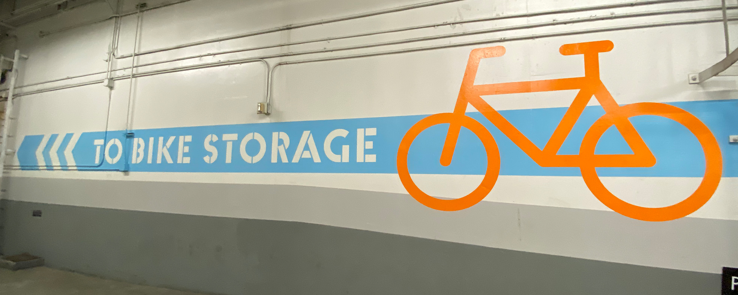Directional Epoxy Hand Painted Bike Graphics on Wall
